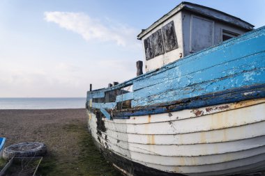 Abandoned fishing boat ruin on beach during lovely Summer mornin clipart
