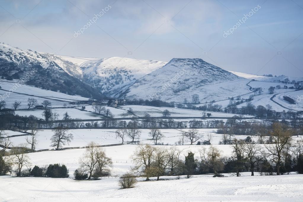 Beautiful Winter landscape snow covered fields in countryside