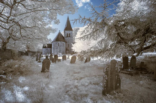 Infrared landscape of old church in churchyard in English countr — Stock Photo, Image