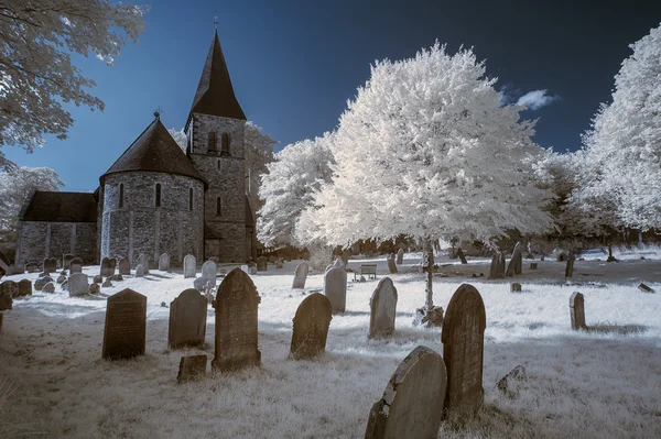 Infrared landscape of old church in churchyard in English countr — Stock Photo, Image