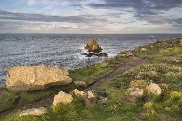 Stunning sunrise landscape image of Land's End in Cornwall Engla — Stock Photo, Image