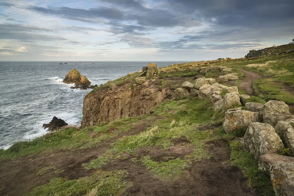 Stunning sunrise landscape image of Land's End in Cornwall Engla — Stock Photo, Image