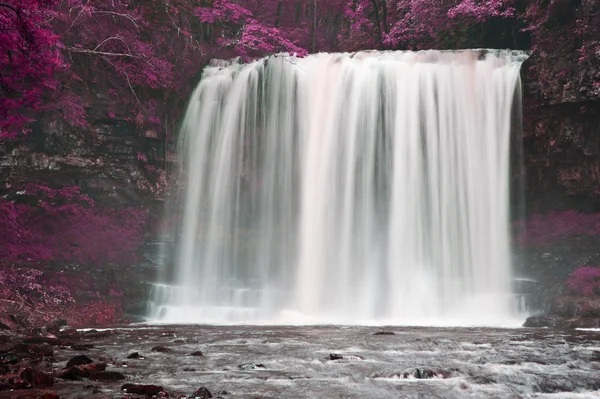 Beautiful alternate colored surreal waterfall landscape — Stock Photo, Image