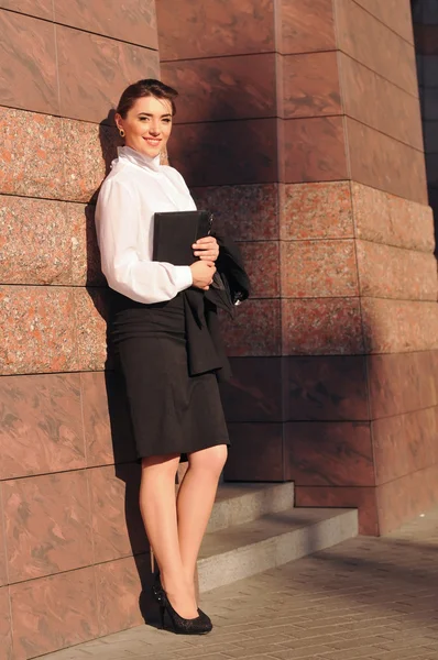 Beautiful businesswoman portrait near pink wall with tile — Stock Photo, Image