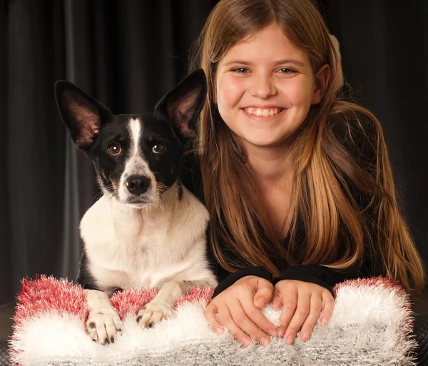 Flicka och hennes hund Stockfoto