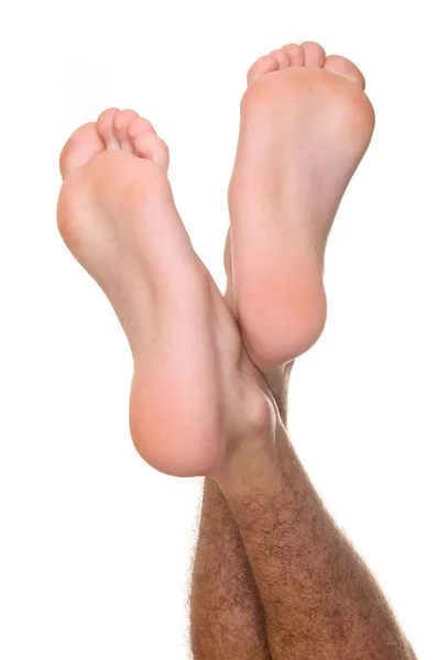 Men a foot and a heel on a white background — Stock Photo, Image