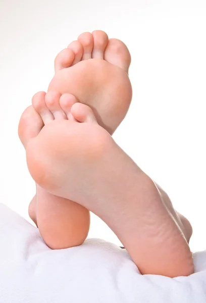 Men a foot and a heel on a white background — Stock Photo, Image