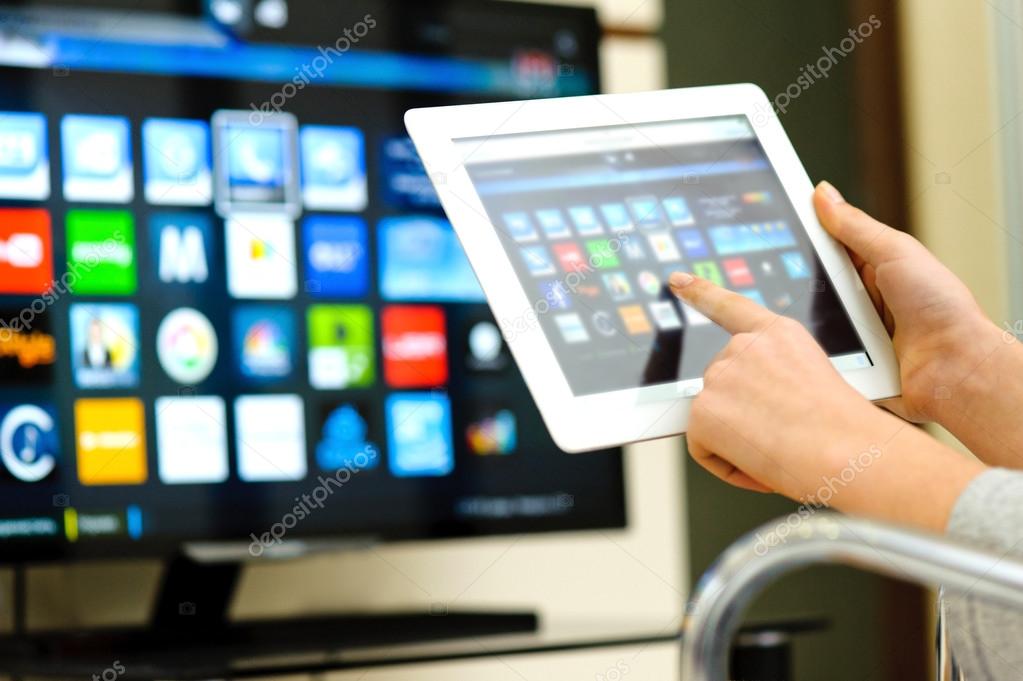 Closeup of a tablet pc connected to a tv — Stock Photo © RasulovS 66078167