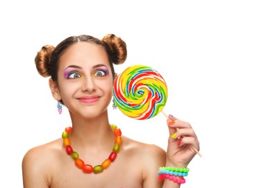 Kız yeme renkli lolipop. Lolipop.