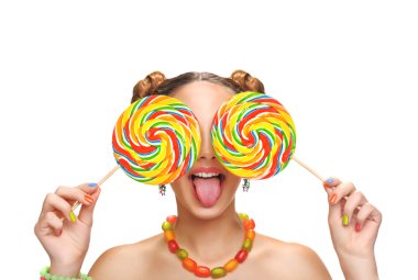 Kız yeme renkli lolipop. Lolipop.