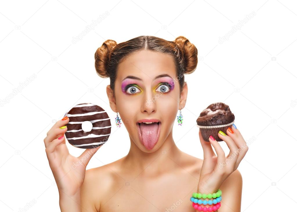 Beautiful  girl with colorful donut and muffin .  Isolated on white background