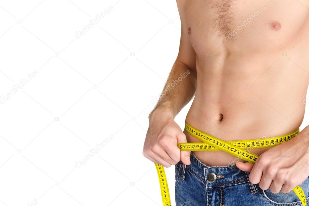 Young man measuring her waist