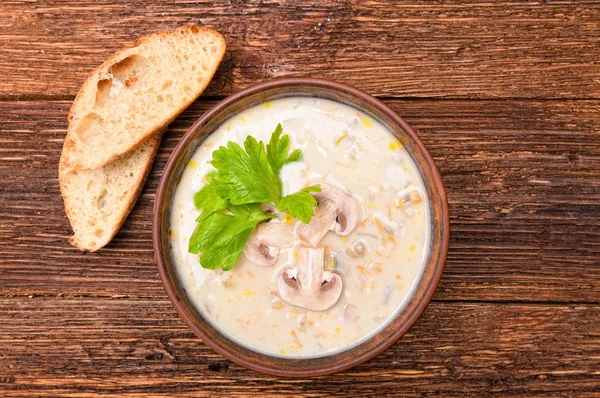 Mushroom soup on a wooden table. — Stock Photo, Image