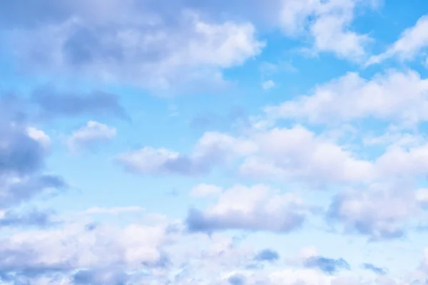 Delicate Blue Sky Background in Pastel Shades with White Clouds
