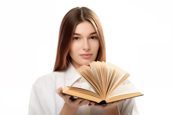 Mujer joven sosteniendo libro con páginas abiertas —  Fotos de Stock