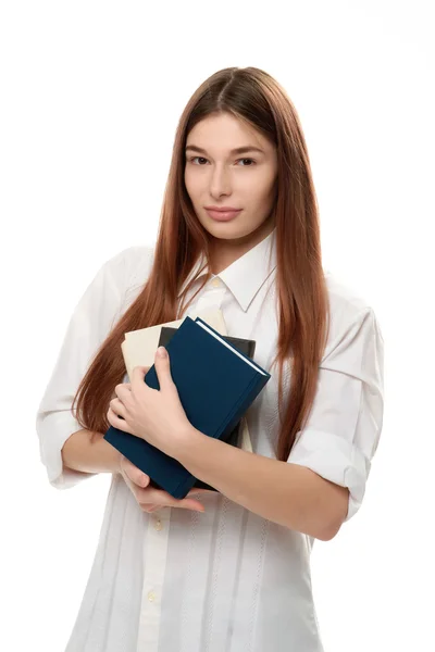 Mujer joven sosteniendo libros —  Fotos de Stock