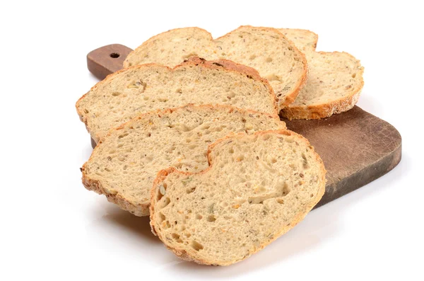 Sliced loaf of bread on a cutting board isolated on white — Stock Photo, Image