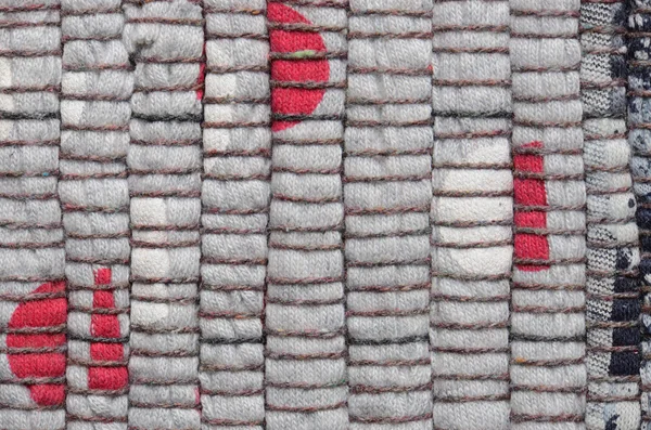 Close up varicolored knitted carpet background — Stock Photo, Image