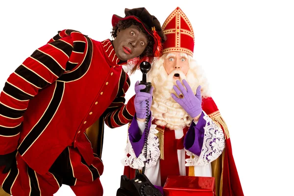 Sinterklaas und zwarte piet mit telefon — Stockfoto