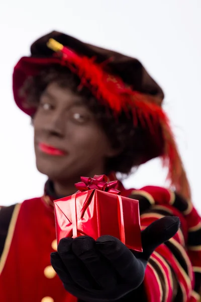 Black Pete showing gift — Stock Photo, Image