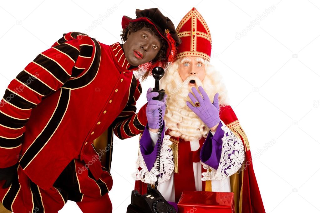 Diverse stel voor kosten Sinterklaas and zwarte piet with telephone Stock Photo by ©twixx 52716617
