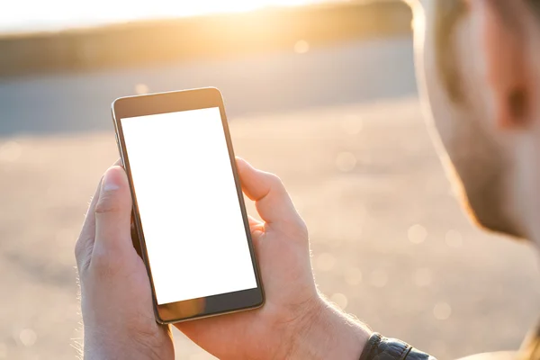 Man uses his Mobile Phone outdoor, close up — Stock Photo, Image