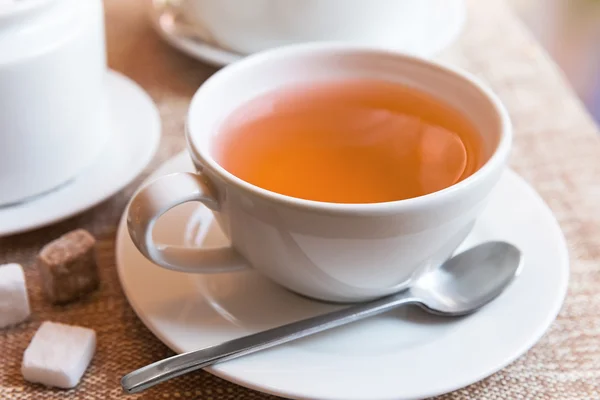 Cup of tea and tea pot — Stock Photo, Image