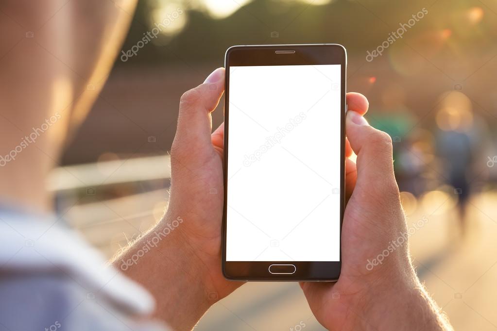 Man uses his Mobile Phone outdoor