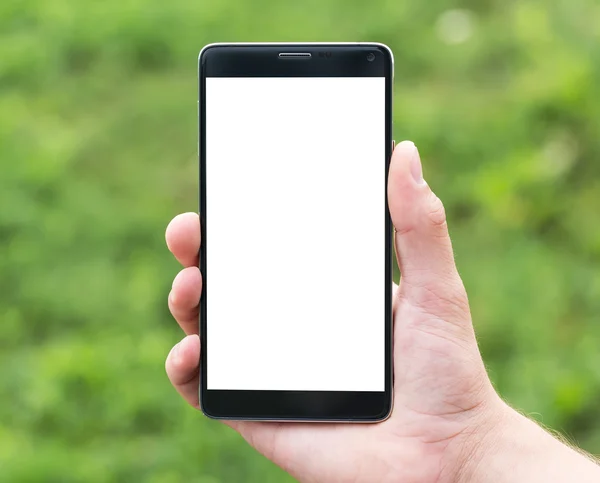 Mann hält Smartphone in der Hand — Stockfoto