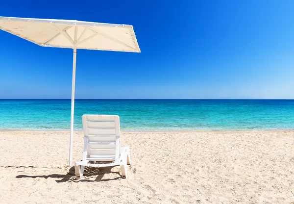 Beach chair with umbrella — Stock Photo, Image