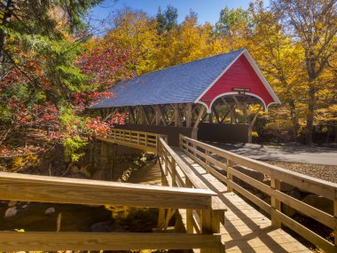 Old red covered bridge clipart