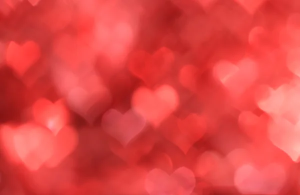 Abstracte rode achtergrond met hart-vormige boke — Stockfoto