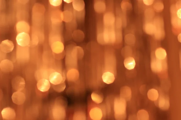 Festive gold background with bokeh effect — Stock Photo, Image