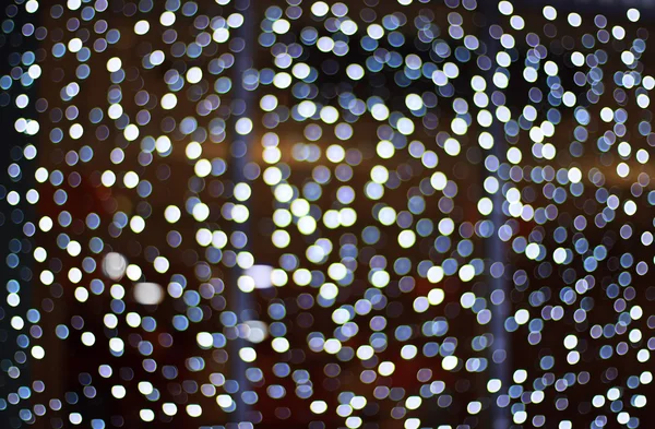 Fondo oscuro abstracto con bokeh blanco — Foto de Stock