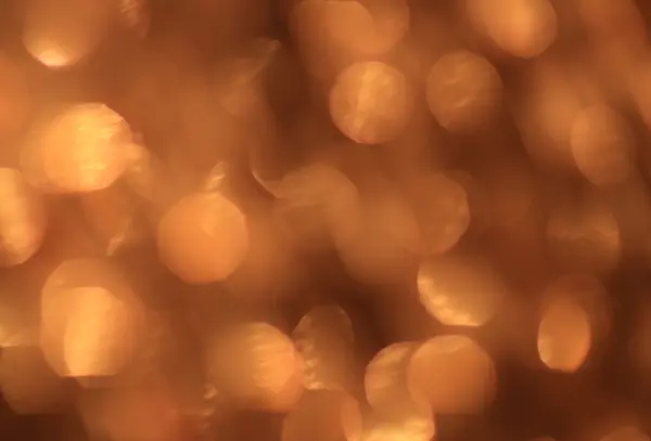 Festive gold background with bokeh effect — Stock Photo, Image