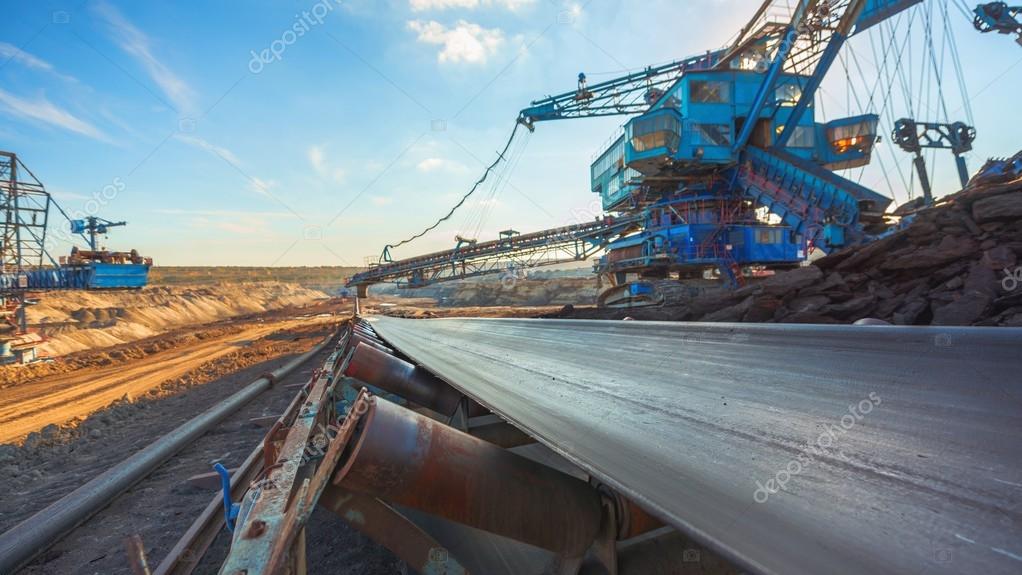 Long conveyor belt transporting ore Stock Photo by ©svedoliver 100145586