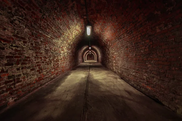 Long underground brick tunnel angle shot — Stock Photo, Image