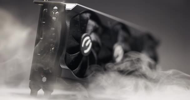 Graphics card with smoke rising and dark background — Stock Video