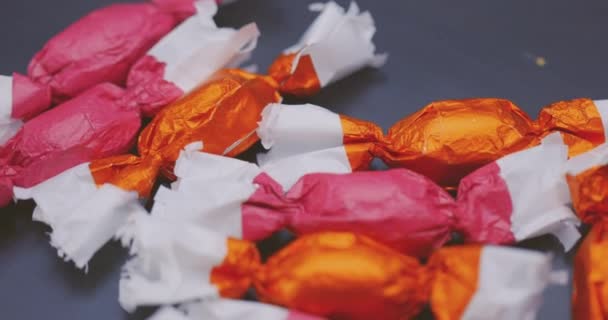 Christmas candy lying on the table with camera in motion closeup — Stock Video