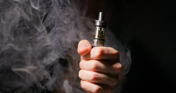 Electronic Cigarette Grabbed Male Hand Dark Background Vapor Closeup — Stock Photo, Image