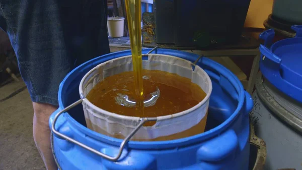 Raw honey pouring out close up footage