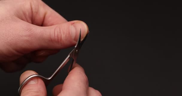 Man Cuts Fingernail Himself — Stock Video