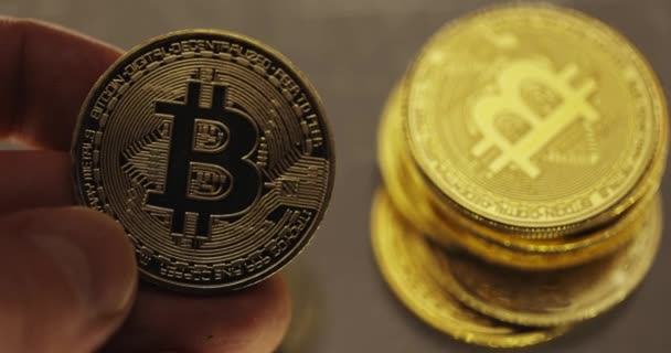 Inspecting Physical Bitcoin Held Hands Closeup — Stock Video