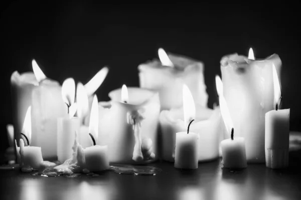 Candles glowing against dark background — Stock Photo, Image