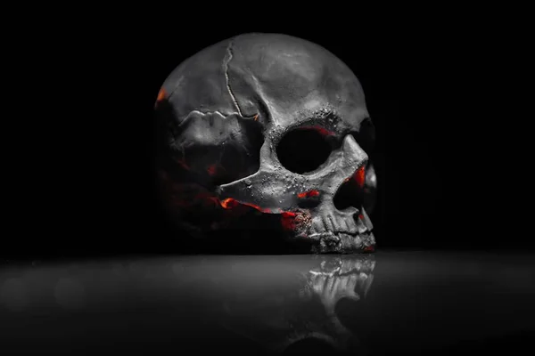 Spooky dark black skull aginast dark background — Stock Photo, Image