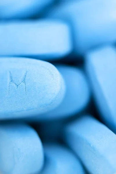 Rotating big blue medical pills closeup — Stock Photo, Image