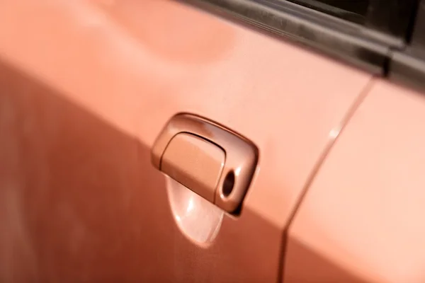 Handle of an orange car closeup — Stock Photo, Image