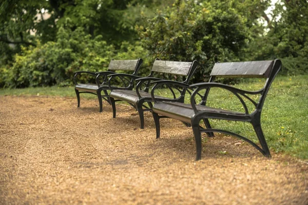 Stylish bench in autumn park — Stock Photo, Image