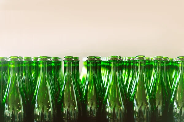 Many bottles on conveyor belt — Stock Photo, Image