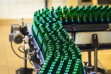Many bottles on conveyor belt clipart